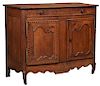 French Provincial Louis XV Style Inlaid Carved Cherry Sideboard, 19th c., the ogee edge canted corner top over a long frieze drawer above arched doubl