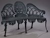 American Style Cast Iron Garden Settee, 20th c., the arched pierced backs to scrolled arms, over a pierced serpentine seat, on cabriole legs, H.- 34 i