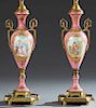 Pair of Bronze Mounted Sevres Style Bronze Ormolu Mounted Pink Porcelain Lamps, early 20th c., of baluster form, with ormolu handles, one with a reser