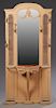 French Polychromed Mahogany and Cane Hall Stand, c. 1910, the stepped arched top over a central arched wide beveled mirror flanked by carved panels an