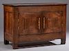 Diminutive French Provincial Carved Oak Sideboard, c. 1770, the thick rectangular top over double cupboard doors with iron escutcheons and short brass