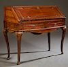 French Louis XV Style Carved Walnut Slant Front Secretary, 19th c., the rectangular top over a fielded panel slant lid enclosing an interior fitted wi