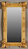 French Gilt and Gesso Overmantle Mirror, 19th c., with relief fleur de lis corners flanking engaged turned and reeded columns around a rectangular pla
