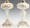 Pair of Meissen Style Porcelain Lamps, early 20th c., in the form of oil lamps, with floral encrusted decoration, the round "font" on a tapered relief