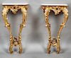 Pair of French Louis XV Style Gilt Marble Top Console Tables, 20th c., the stepped rounded edge bow front marble over a gilt and gesso base with a pie