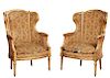 Pair of French Louis XVI Style Gilt Bergeres, 19th c., the arched curved crest rails above upholstered high backs, arms and cushion seats, on fluted t