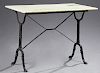 French Cast Iron Marble Top Bistro Table, 19th c., the rectangular rounded edge figured white marble on splayed iron trestle supports, joined by an X-
