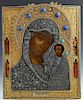 Russian Icon of the Virgin of Kazan, Moscow, 1856, with a gilt silver filigree oklad mounted with cabochon semi-precious stones with a maker's mark of