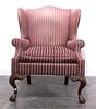 A Chippendale Style Wingback Armchair, Height 42 inches.