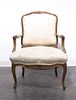 A Louis XV Style Walnut Fauteuil, Height 35 inches.