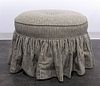 An Upholstered Stool, Height 19 x diameter 26 1/2 inches.