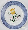 Blue spatter plate with yellow tulip
