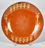 Large Pennsylvania slip decorated redware plate