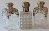 Three crystal bottles with silver tops. 
height 6 1/2 inches 
***If this lot is not picked up on Sat. 9/22, Sun. 9/23, or Tues 9/25 ...
