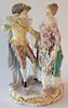 Double Meissen porcelain figure having a woman in elegant dress and cavalier with painted playing cards on his vest, marked with blu...