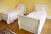 Three twin beds including a sleigh bed (one with headboard only) and a trundle bed. 
sleigh bed: height 44 inches, 
bed with headboa...