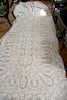 Two crocheted tablecloths (one with stains, one with tears)