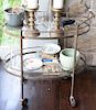 Lot of leftover items on porch to include brass bar cart, bar items, two floor lamps, a metal table, brass decorative lamp, two radi...