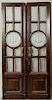 Pair of Custom Made Carved Oak Doors, 20th c., made for a law office, with mullioned glazed etched panes around etched center panels with the scales o