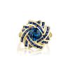 A 10K Gold Blue Topaz and Sapphire Ring