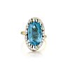 A 14K Gold Blue Topaz and Diamond Ring