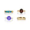 A Group of Four Gold Diamond and Colored Stone Rings