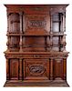 A German Carved Buffet Deux Corps Height 89 x width 70 x depth 24 inches.