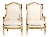 A Pair of Louis XVI Style Giltwood Wing Back Chairs Height 43 1/2 inches.