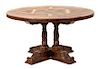 A William IV Style Carved Mahogany Center Table Height 30 x diameter 54 inches.