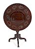 A British Colonial Carved Mahogany Tripod Table Height 28 1/2 x diameter 29 inches.