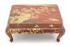 A Japanese Red and Gilt Lacquer Miniature Presentation Table Height 4 1/2 x width 10 7/8 x depth 8 7/8 inches.