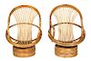 A Pair of Barrel-Back Rattan Armchairs on Swivel Bases Height 40 inches.