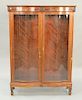 Mahogany Victorian inlaid curio cabinet with two bowed glass doors. ht. 66 in., wd. 48 in.