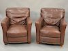 Pair of Brown leather easy chairs (slight scratches). ht. 36 in., wd. 34 in.