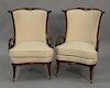 Pair of vintage mahogany fan back chairs with open carved arms.