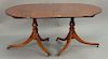 Mahogany double pedestal dining table with base wood banded inlaid top and two 16 inch leaves. ht. 29 in., top closed: 62" x 44", op...