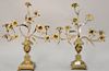Pair of bronze candelabra having urns with flowers. ht. 20 in.