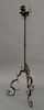 Wrought iron pricket stand with turned brass joints. ht. 65 in.