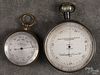 Pocket barometer by Keuffel & Esser, N.Y., 2 3/4'' dia., together with an English example, 2'' dia.