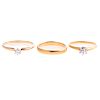 A Pair of Diamond Solitaire Rings & Band