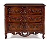 A Louis XV Provincial Walnut Commode Height 38 x width 48 x depth 24 1/2 inches.