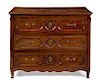 A Louis XV Provincial Style Oak Commode Height 38 x width 48 1/2 x depth 27 1/2 inches.