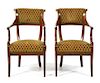 A Pair of Directoire Mahogany Armchairs Height 34 1/4 inches.