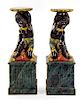 A Pair of Painted and Parcel Gilt Figural Pedestals Height 39 1/8 x width 13 1/4 x depth 13 1/4 inches.