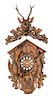 * A Black Forest Carved Clock Height 27 x width 18 x depth 18 inches.