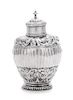 A Dutch Silver Tea Caddy, 18th Century, of ovoid form, the body with a reeded band among chased and repousse foliate decoration.