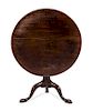 A George II Mahogany Tilt-Top Table Height 26 x diameter of top 34 inches.