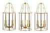 A Set of Three Brass Five-Light Hall Lanterns Height 50 inches.