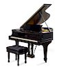 A Steinway & Sons Black Lacquered Baby Grand Piano Length of case 70 inches.