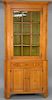 Maple and tiger maple two part corner cupboard. 
height 88 in., width 42 in., depth 24 in.